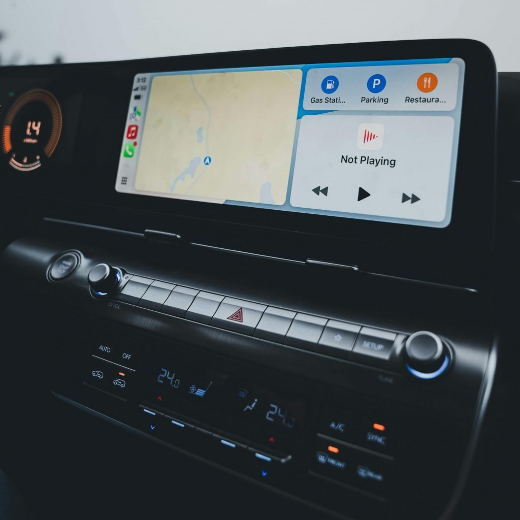 Car dashboard showcasing a modern infotainment system with GPS navigation and climate controls.